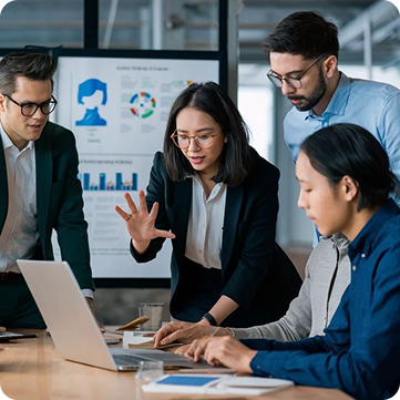 A team evaluating existing AI tools together around a laptop